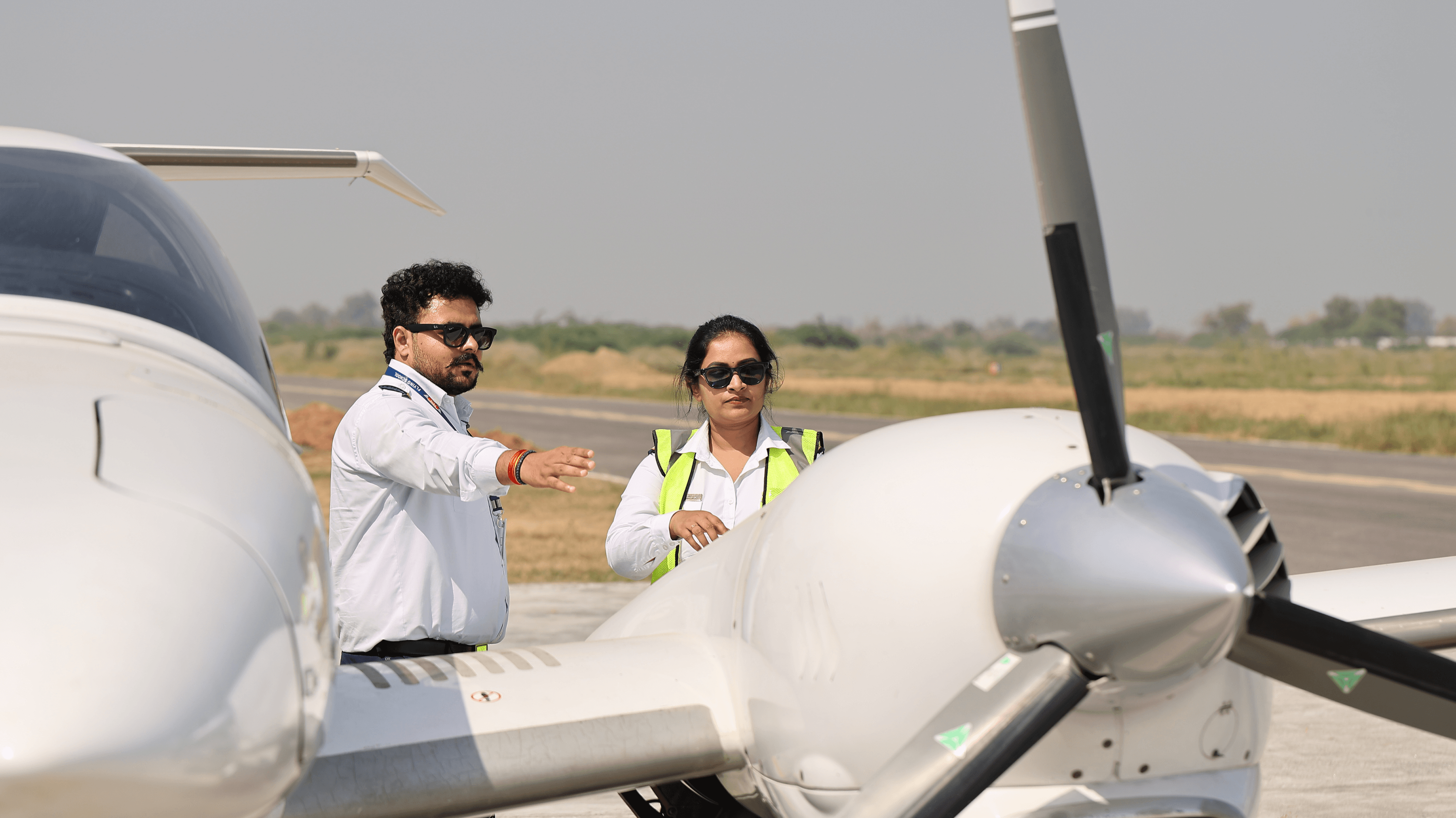Female pilot with aircraft
