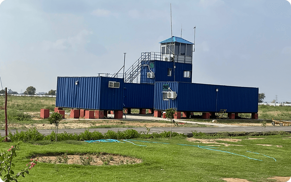 Aircraft in flight over airfield