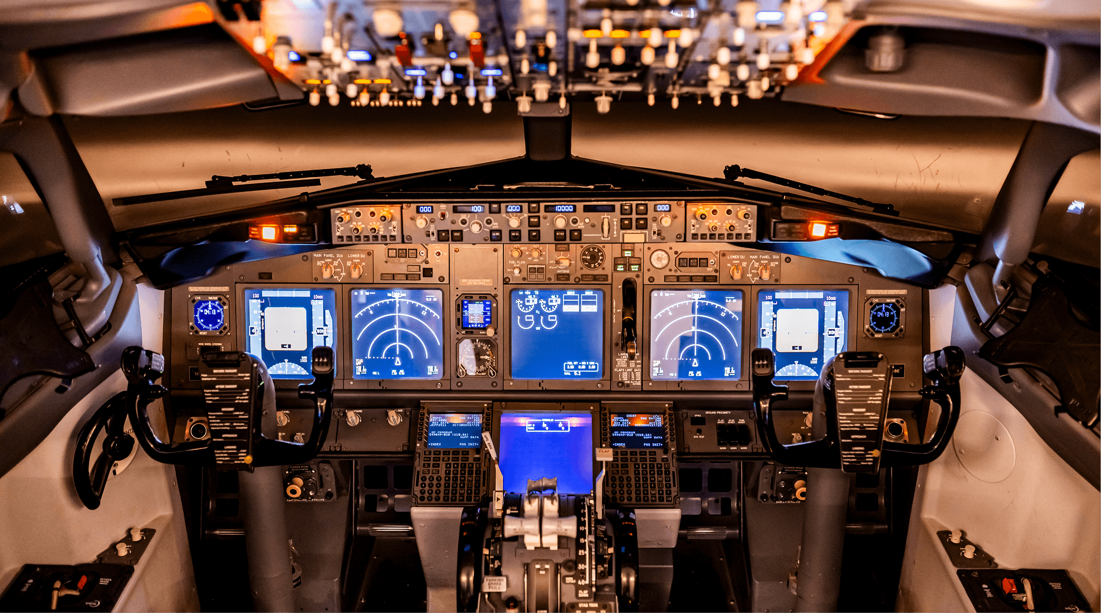 Pilot in airplane cockpit looking out window